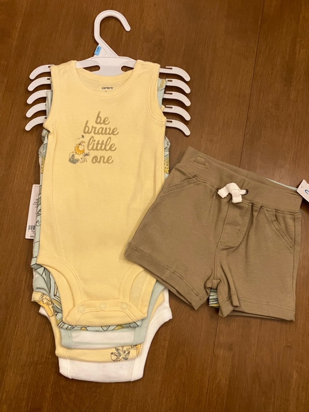 6M 5-piece set bodysuits + 2 pairs shorts. Carter’s. Pastel yellow, green.